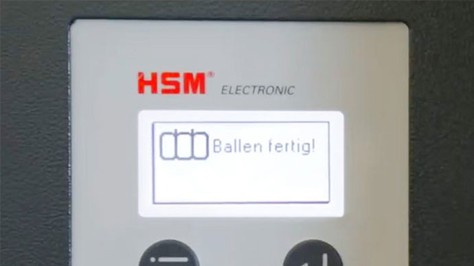 Información automática en cuanto se ha comprimido suficiente material para una bala y ésta puede atarse